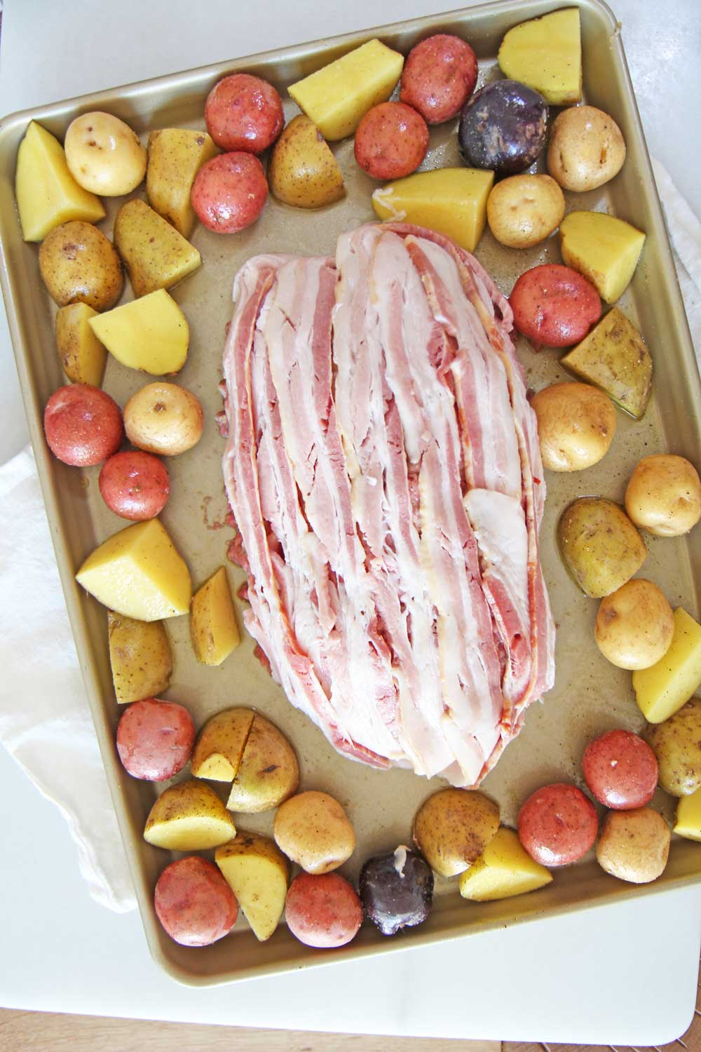 Bacon Meatloaf and Potato Sheet Pan Recipes. The whole meal is done on a sheet pan. The meatloaf is infused with bacon and bacon on top! This is a perfect Christmas dinner, Sunday dinner, or birthday recipes. Happy Cooking! www.ChopHappy.com #baconrecipe #meatloafrecipe