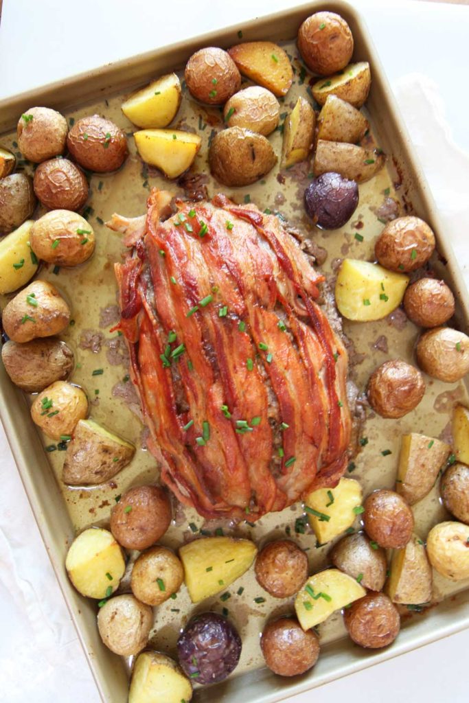 Bacon Meatloaf and Potato Sheet Pan Recipes. The whole meal is done on a sheet pan. The meatloaf is infused with bacon and bacon on top! This is a perfect Christmas dinner, Sunday dinner, or birthday recipes. Happy Cooking! www.ChopHappy.com #baconrecipe #meatloafrecipe