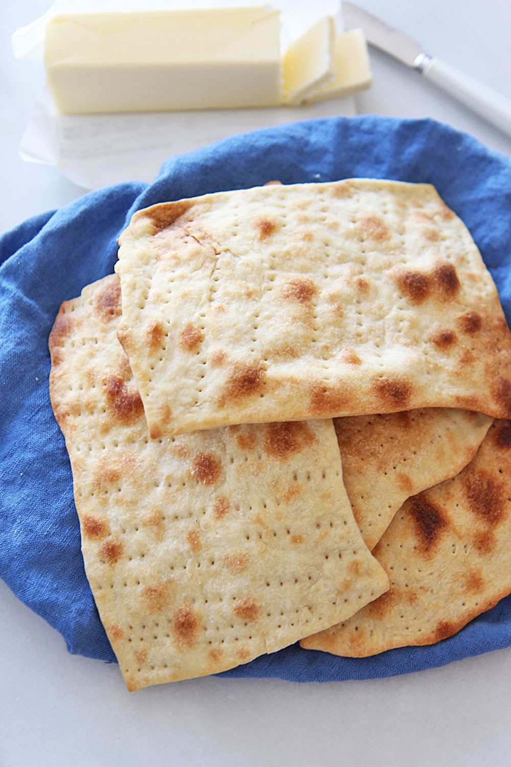 How to Make Matzah at Home.Homemade matzo is so easy because uses pantry ingredients, tastes bakery fresh, and its in honor of my moms Passover Seder! Happy Passover! www.ChopHappy.com #Passoverrecipes #matzorecipe