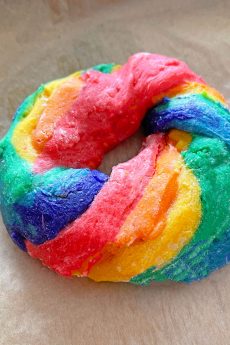 3 Ingredient Rainbow Bagels Recipe. Just Greek yogurt, flour and food coloring is all you need for rainbow bagels! Easy bagel recipe for brunch or fun breakfast. #priderecipe #rainbowrecipes