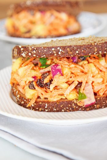 Carrot Salad Sandwich Recipe. This is a perfect vegetarian sandwich recipe that is healthy. This is from The Happy Sandwich Cookbook that has 50 recipes for busy people. www.ChopHappy.com #vegetariansandwich #sandwichrecipe
