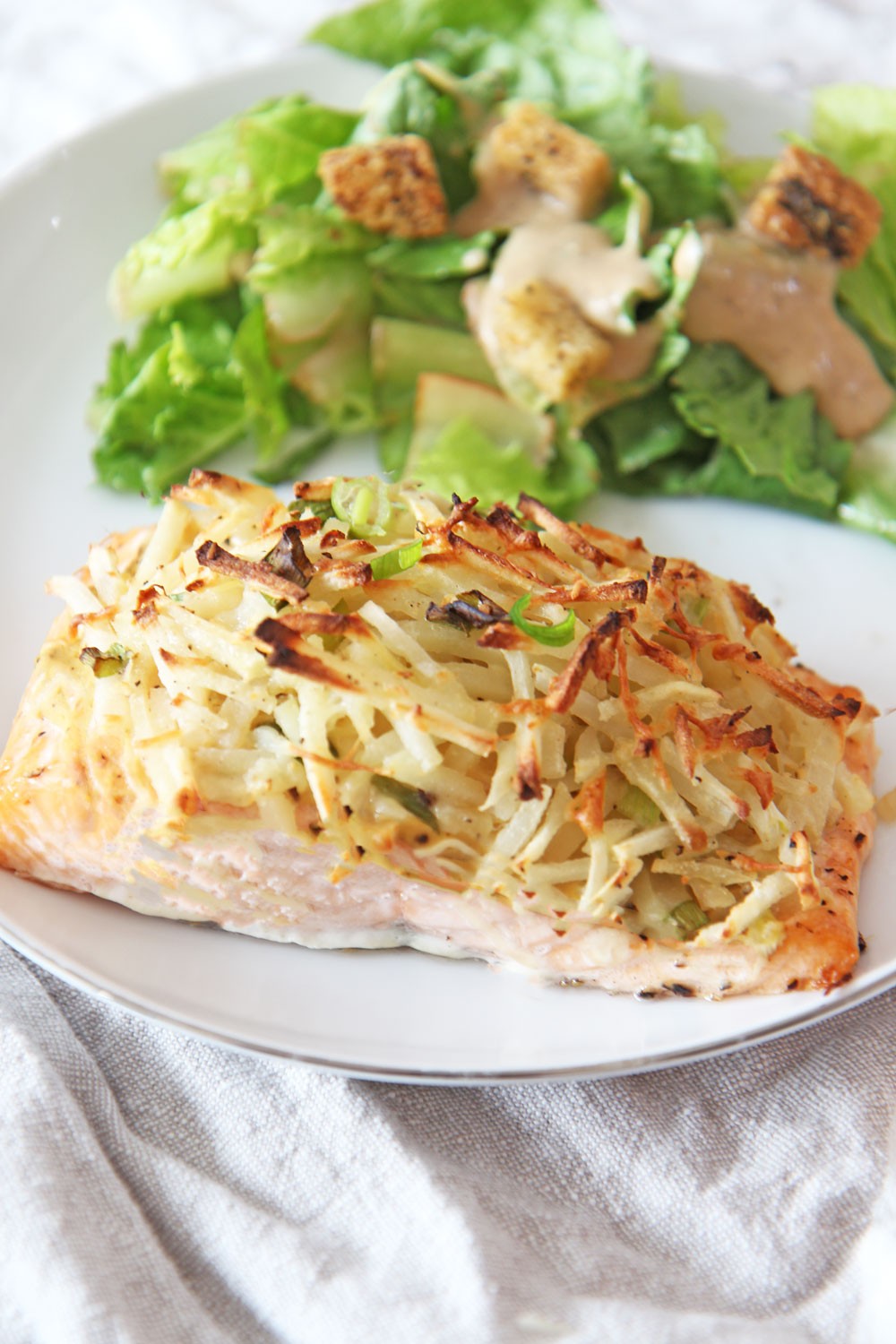 Latke Crusted Salmon on a sheet pan. This is a perfect Jewish Holiday Recipe. Make this as a Rosh Hashanah recipe, Hanukkah recipe, Yom Kippur recipe, or Shabbat recipe. Happy Holidays. www.ChopHappy.com #jewishrecipes #jewishholidayrecipes