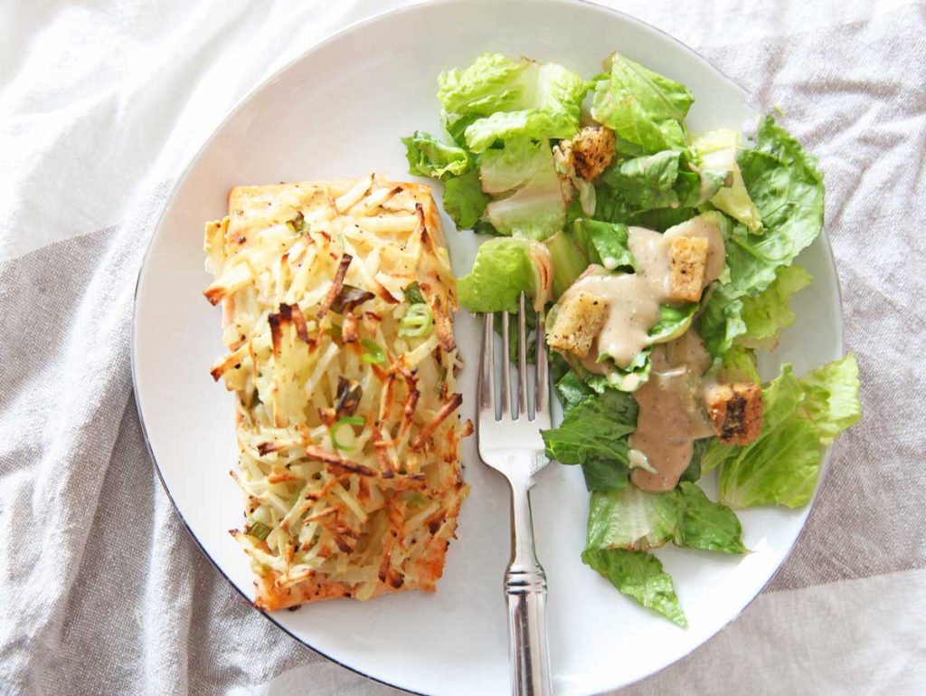 Latke Crusted Salmon on a sheet pan. This is a perfect Jewish Holiday Recipe. Make this as a Rosh Hashanah recipe, Hanukkah recipe, Yom Kippur recipe, or Shabbat recipe. Happy Holidays. www.ChopHappy.com #jewishrecipes #jewishholidayrecipes