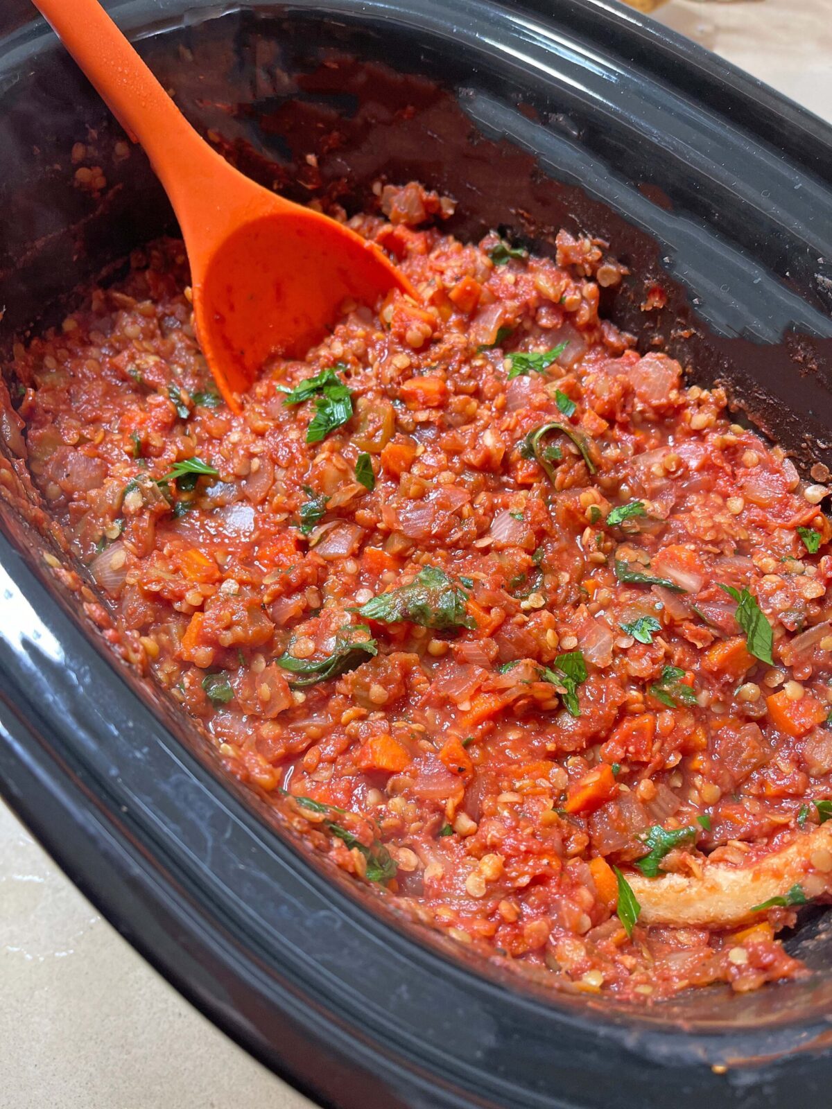 Slow Cooker Lentil Bolognese. Easy vegetarian pasta recipe for was comfort food dinner. Happy Cooking! www.ChopHappy.com #LentilBolognese #slowcookerpastasauce