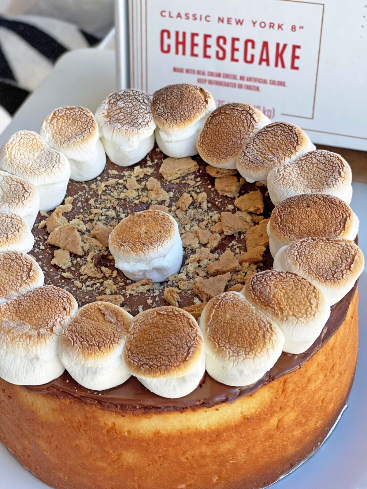 S'mores Cheesecake Topping Recipe. I used the iconic NYC cheesecake  to make a chocolate marshmalllow easy dessert. www.ChopHappy.com #NYCcheesecake #s'mores 