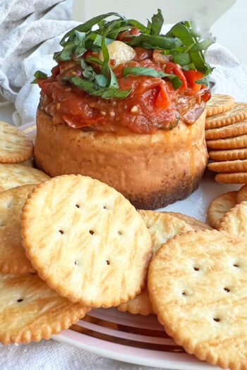 Tomato Basil Cheesecake Dip. This is an easy cheese appetizer recipe. Salty and sweet cheese with a tomato basil topping. Happy Cooking! www.ChopHappy.com #cheesedip #cheesecake