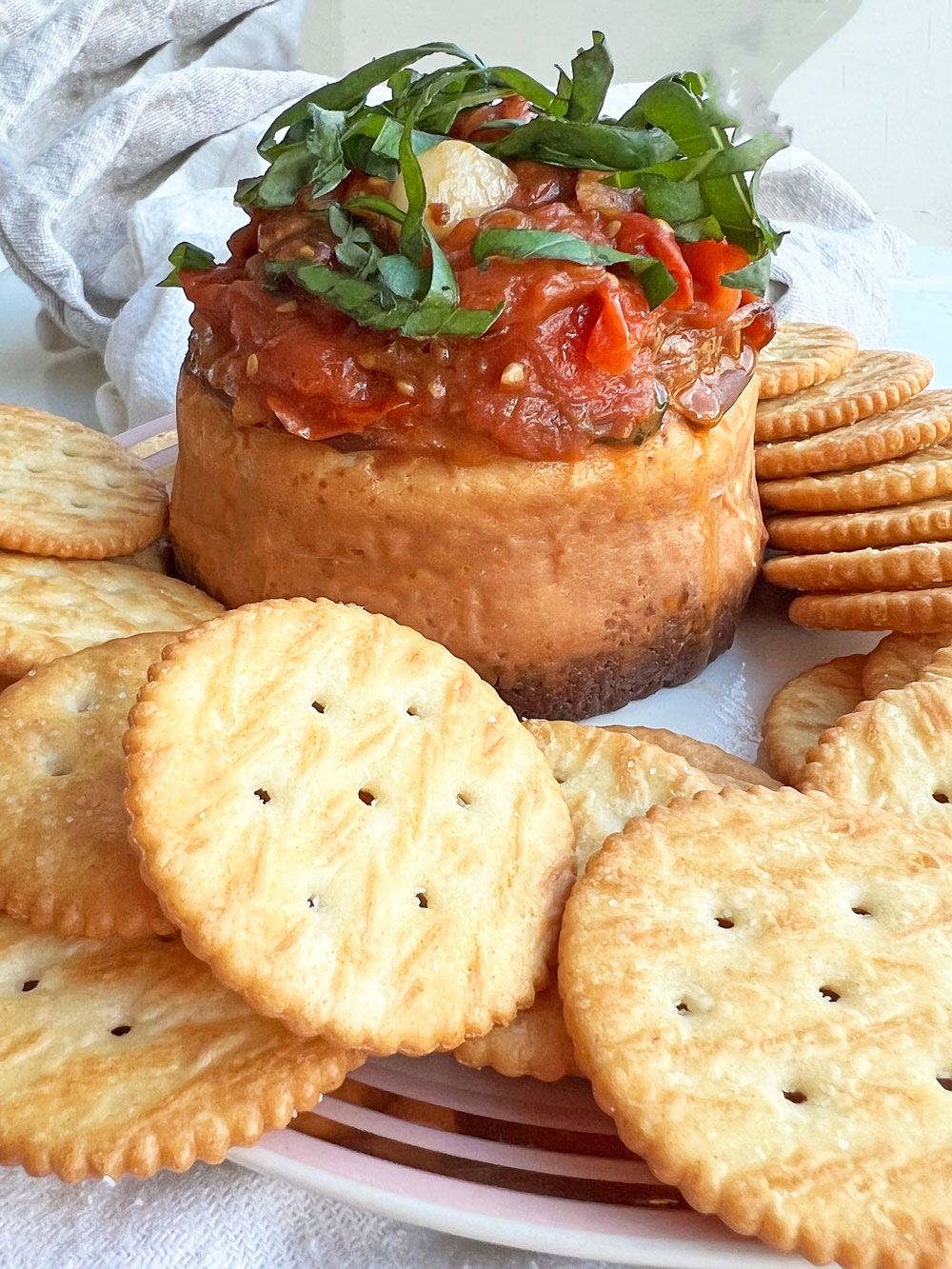 Tomato Basil Cheesecake Dip. This is an easy cheese appetizer recipe. Salty and sweet cheese with a tomato basil topping. Happy Cooking! www.ChopHappy.com #cheesedip #cheesecake