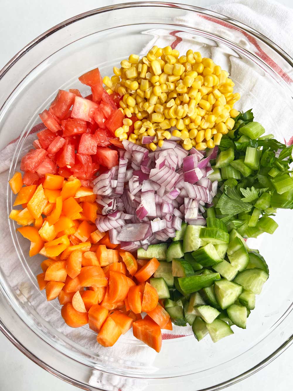 Crunchy Rainbow Salad w/ Pesto Dressing. Healthy recipe that you can make one day and eat all week long. The perfect meal prep recipe. www.ChopoHappy.com #vegetables #saladrecipe