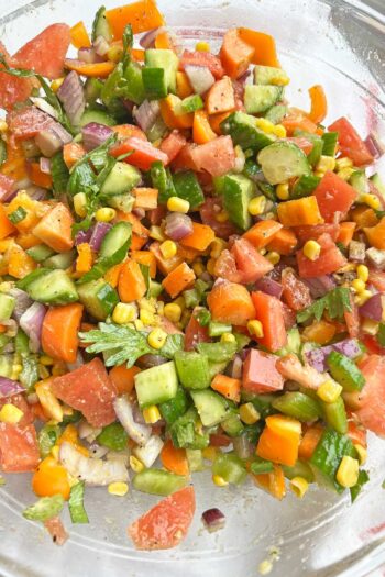 Crunchy Rainbow Salad w/ Pesto Dressing. Healthy recipe that you can make one day and eat all week long. The perfect meal prep recipe. www.ChopoHappy.com #vegetables #saladrecipe