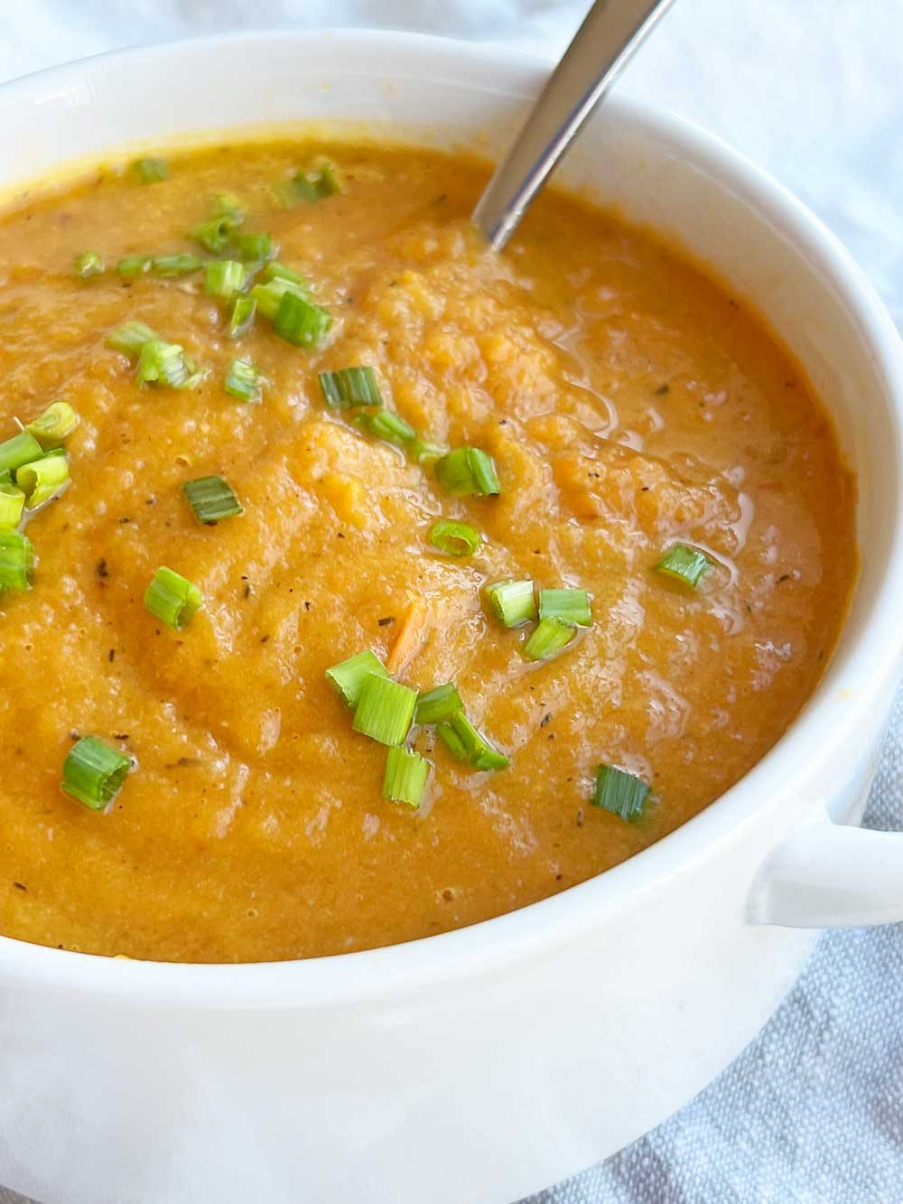 Roasted Carrot Soup Recipe. This is a an easy sheet pan recipe that takes leftover veggies and makes it into soup. Fast recipe with little clean up. Happy Cooking! www.ChopHappy.com #carrotrecipes #carrotsoup