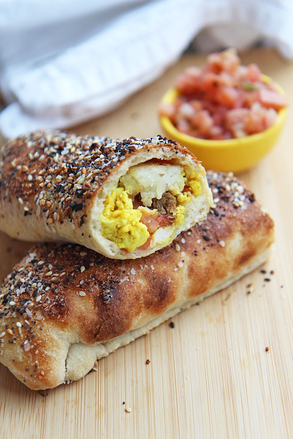 How to Make a Bagel Burrito (Breakfast Burrito). This is the prefect meal prep recipe for a busy weeknight dinner. Also, very budget friendly meal if you use the leftovers in your fridge. www.ChopHappy.com #breakfastburrito #bagelsandwichrecipe